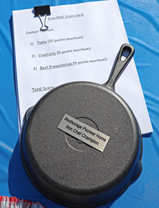 Photo of iron skillet award and paper form for judges.